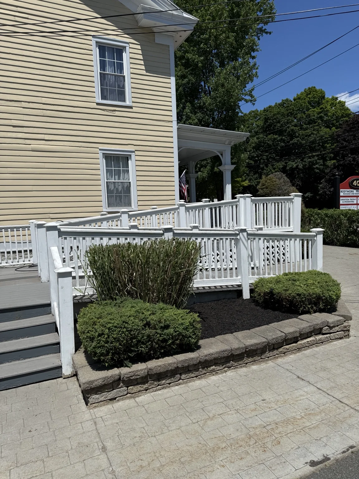 Black mulch installation in raised commercial landscape beds