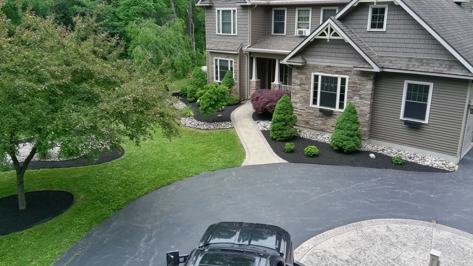 Drone view of completed landscape project with black mulch and stone
