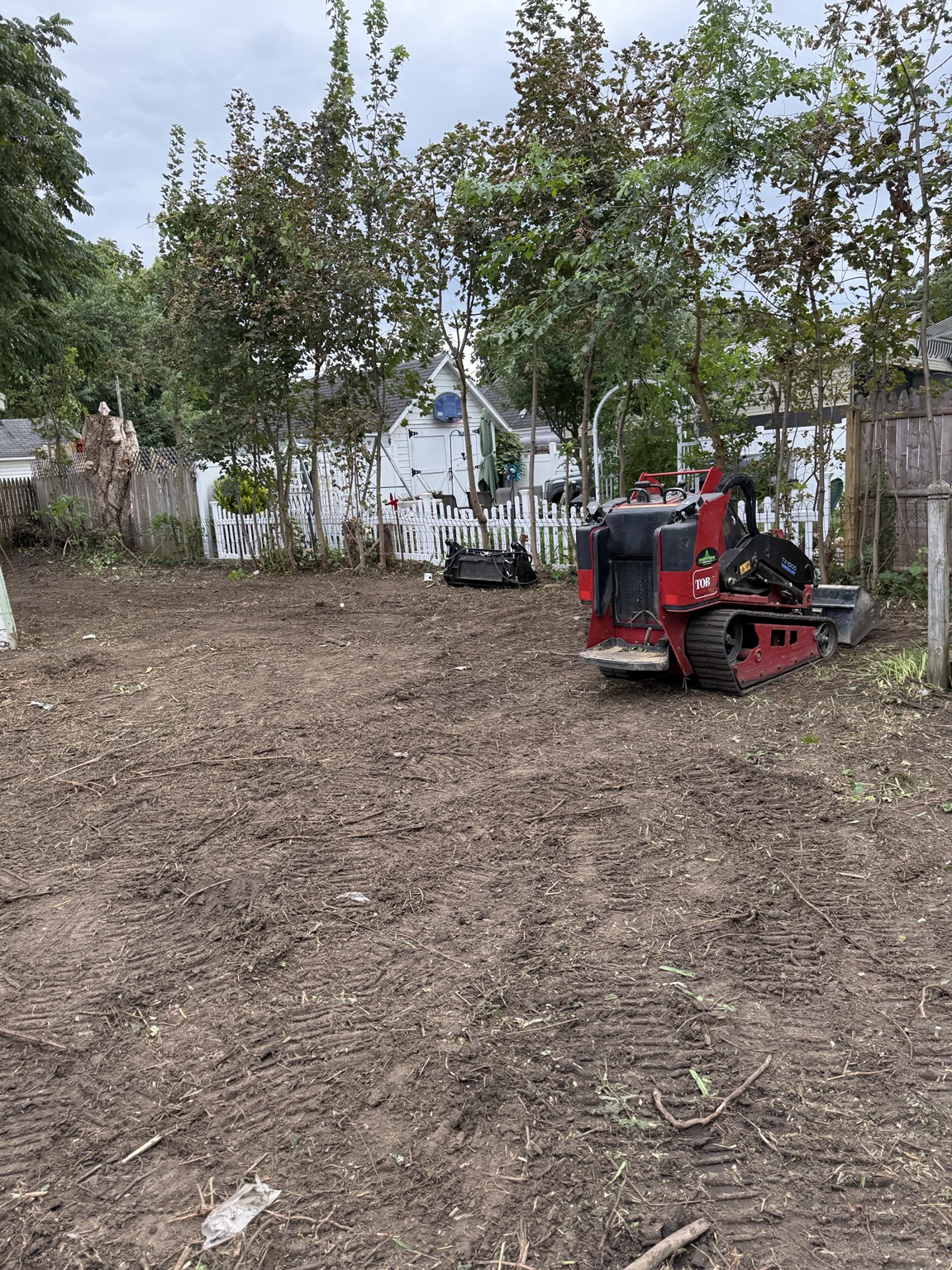 Compact track loader used during property clearing