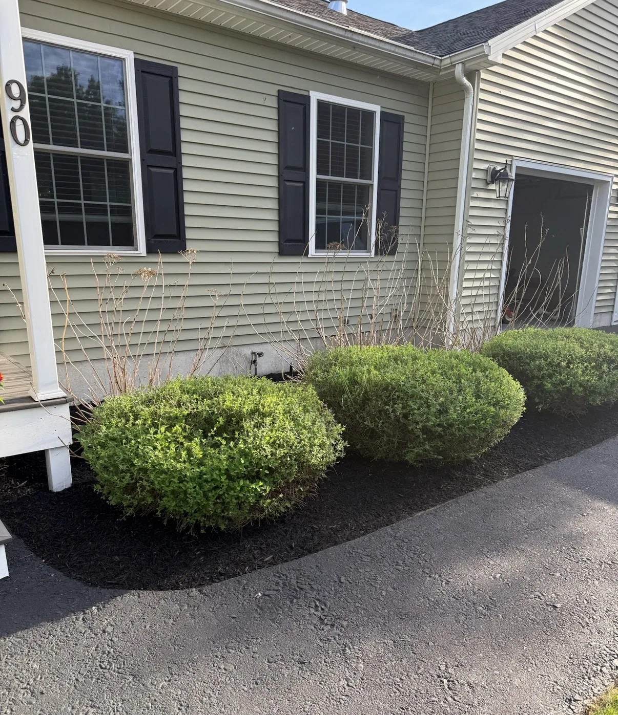 After clean front landscape bed with fresh mulch
