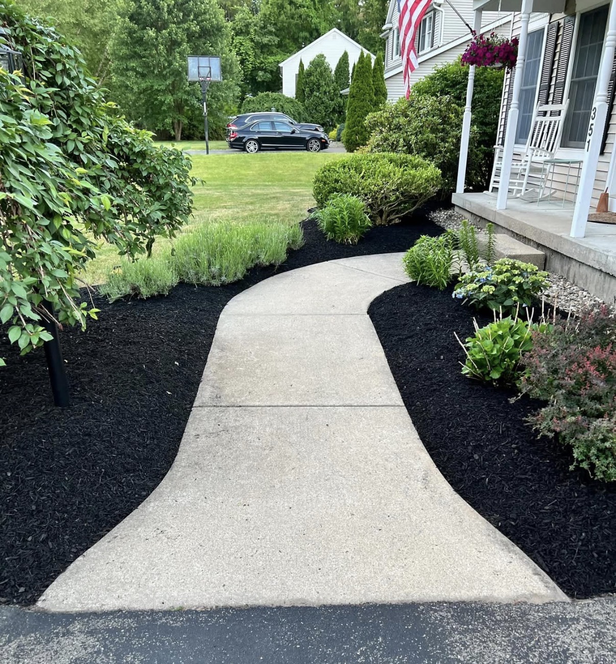 Curved mulch walkway landscape